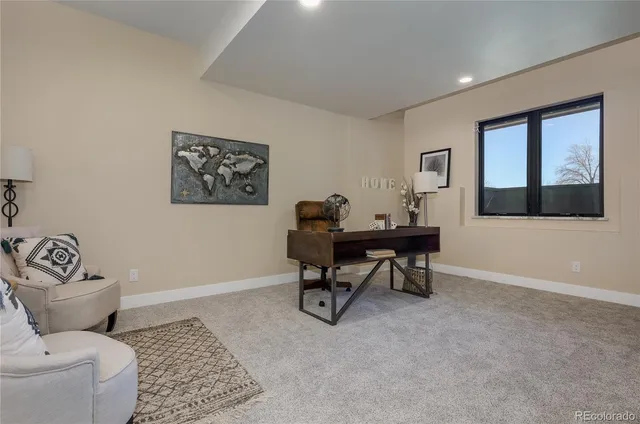 a work room with furniture and windows