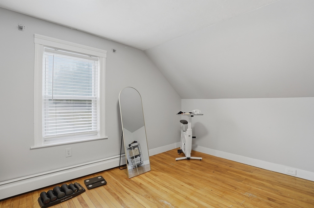 23 Dryden Street Worcester, MA 01605 - Photo 15 of 29 a room with a wooden floor and a window