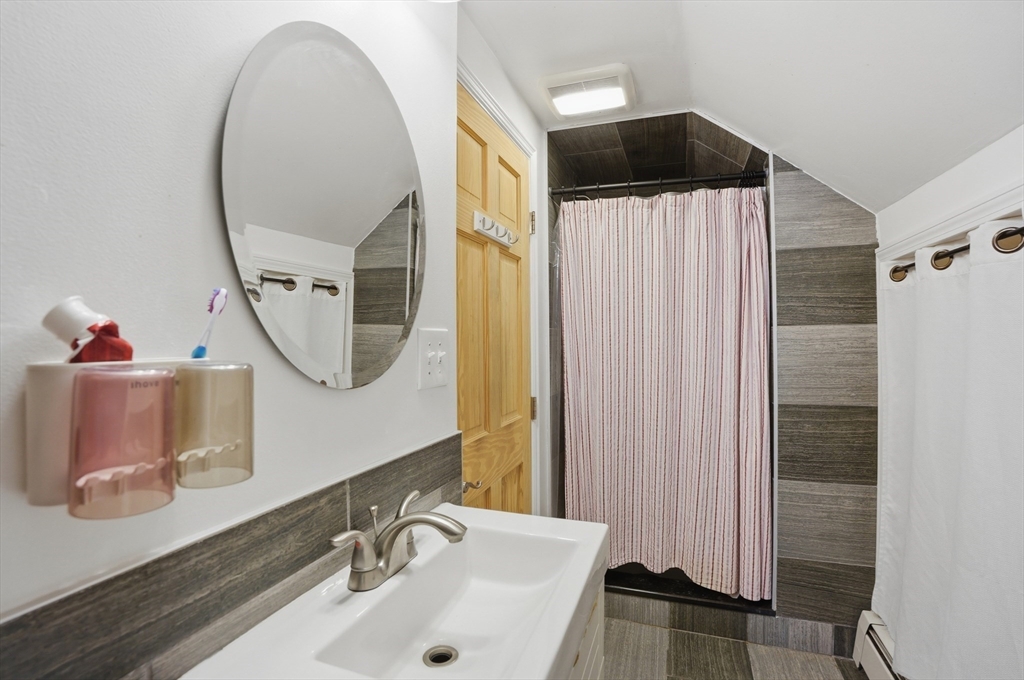 23 Dryden Street Worcester, MA 01605 - Photo 18 of 29 a bathroom with a sink and a mirror