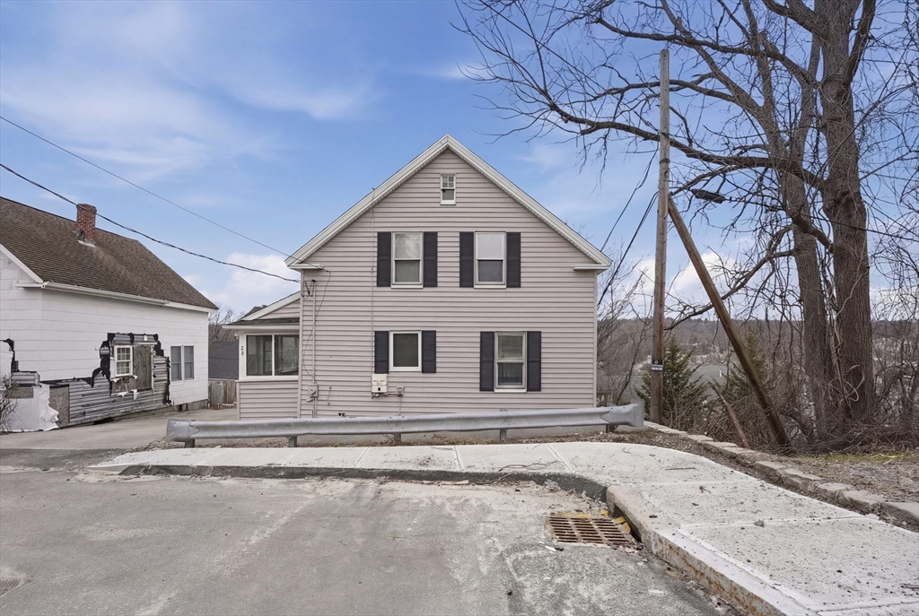 23 Dryden Street Worcester, MA 01605 - Photo 2 of 29 a front view of a house with a yard