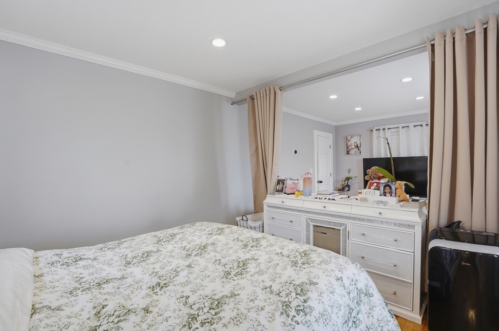 23 Dryden Street Worcester, MA 01605 - Photo 21 of 29 a bedroom with a bed and a view of kitchen