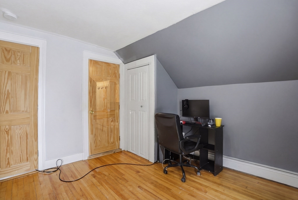 23 Dryden Street Worcester, MA 01605 - Photo 25 of 29 a view of a workspace with furniture and wooden floor