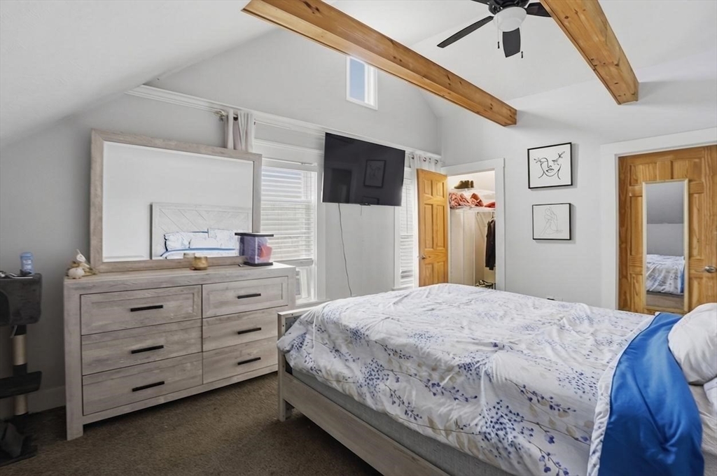 23 Dryden Street Worcester, MA 01605 - Photo 27 of 29 a bedroom with a bed and a dresser