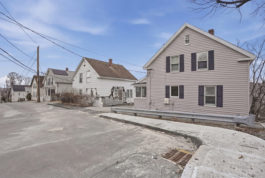 23 Dryden Street Worcester, MA 01605 - Photo 28 of 29 a view of a house with a yard