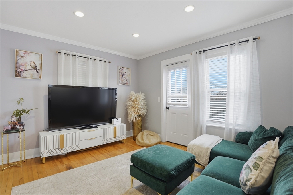 23 Dryden Street Worcester, MA 01605 - Photo 5 of 29 a living room with furniture and a flat screen tv