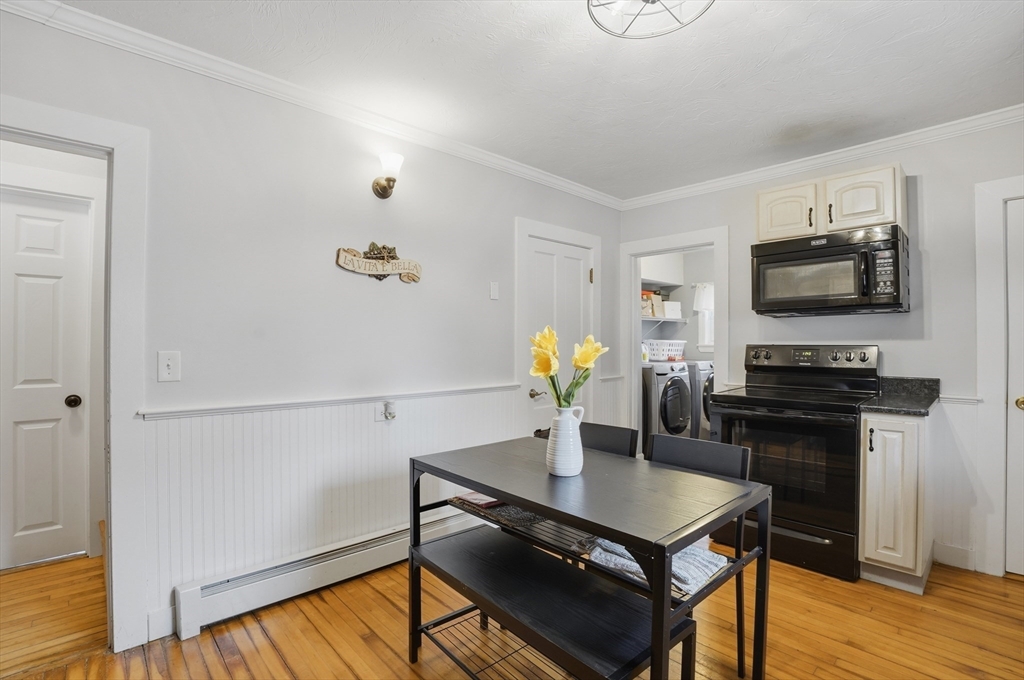 23 Dryden Street Worcester, MA 01605 - Photo 8 of 29 a view of a dining room with furniture and wooden floor