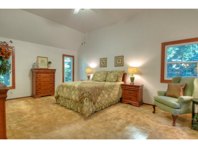 13872 Silver Sky Way Redwood City, CA 94062 - Photo 11 of 24 a bedroom with a bed and a couch