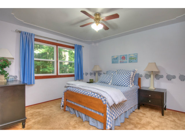 13872 Silver Sky Way Redwood City, CA 94062 - Photo 15 of 24 a bedroom with a bed and a large window