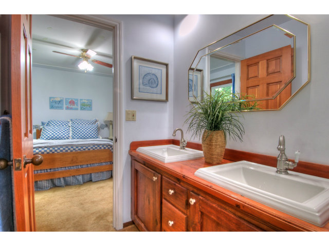 13872 Silver Sky Way Redwood City, CA 94062 - Photo 16 of 24 a bathroom with a sink and a mirror