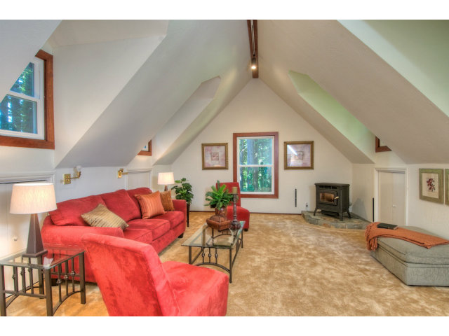 13872 Silver Sky Way Redwood City, CA 94062 - Photo 18 of 24 a living room with furniture a fireplace and a flat screen tv