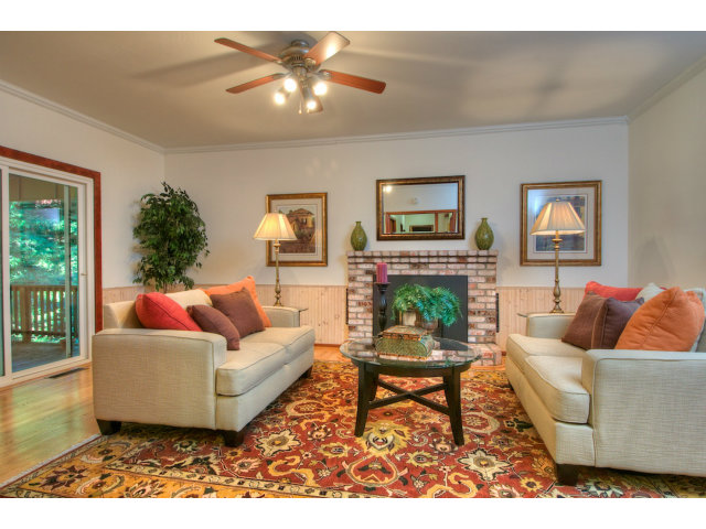13872 Silver Sky Way Redwood City, CA 94062 - Photo 3 of 24 a living room with furniture and a fireplace