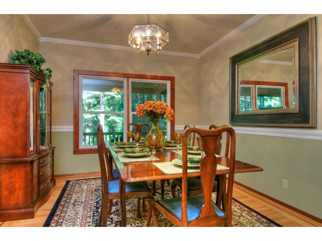13872 Silver Sky Way Redwood City, CA 94062 - Photo 6 of 24 a view of a dining room with furniture a chandelier and wooden floor