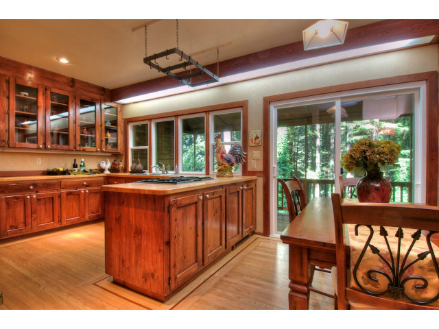 13872 Silver Sky Way Redwood City, CA 94062 - Photo 9 of 24 a open kitchen with stainless steel appliances granite countertop a stove and cabinets