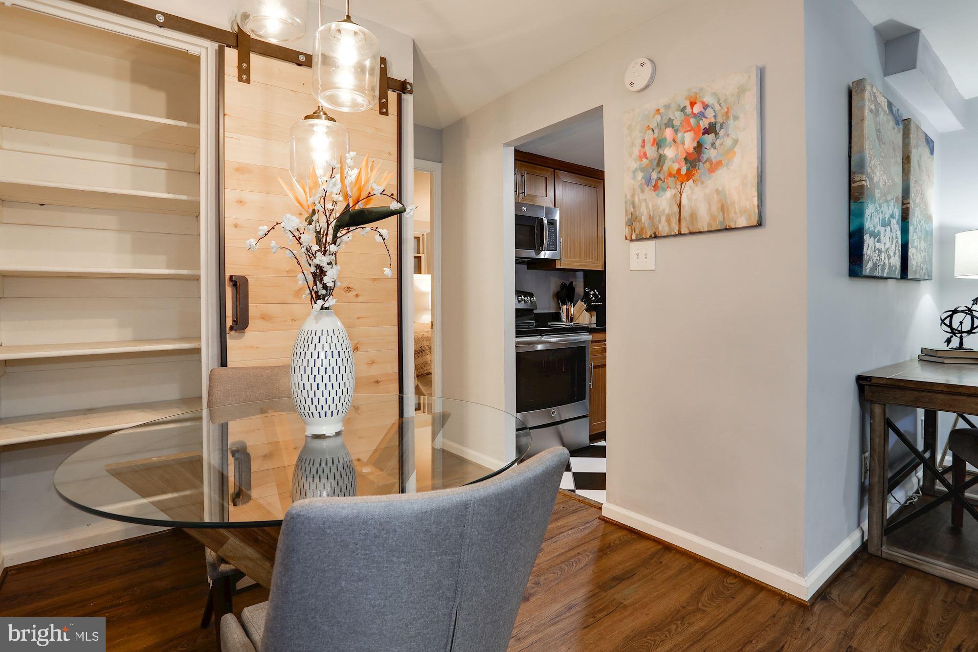 1718 Corcoran Street Northwest, Unit 5 Washington, DC 20009 - Photo 11 of 22 Barn door opens to pantry