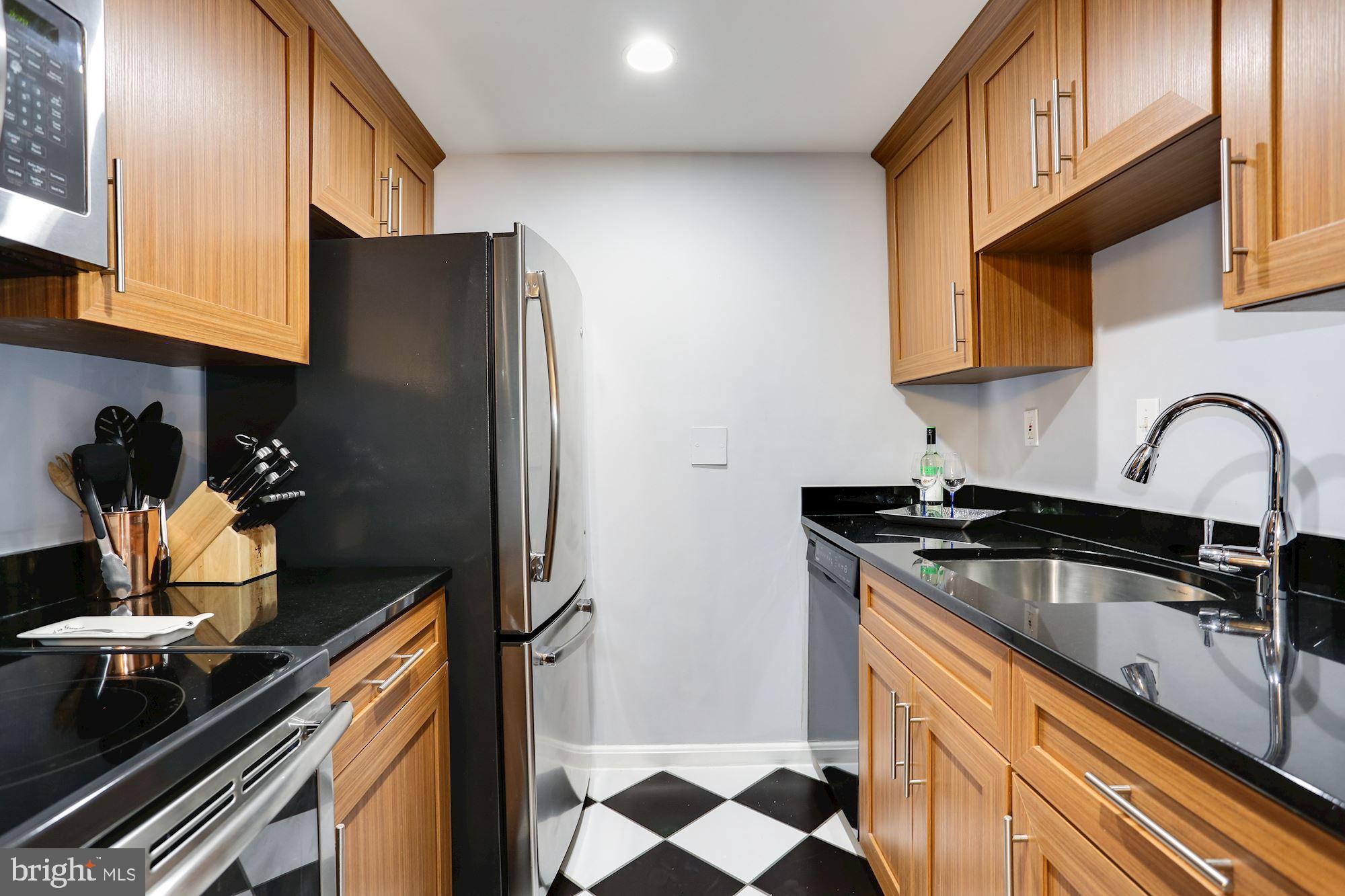 1718 Corcoran Street Northwest, Unit 5 Washington, DC 20009 - Photo 13 of 22 Granite counters & stainless steel appliances