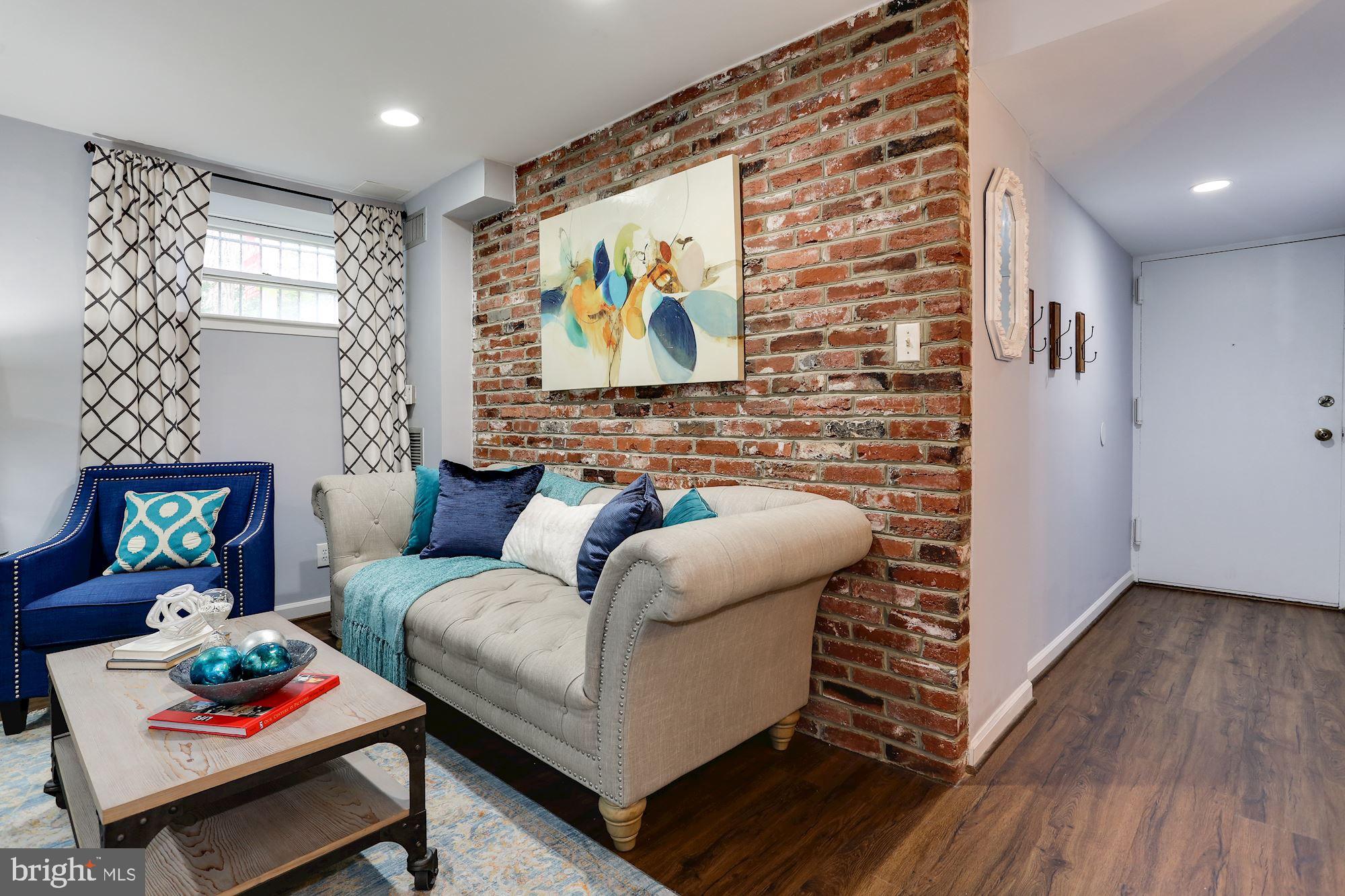 1718 Corcoran Street Northwest, Unit 5 Washington, DC 20009 - Photo 5 of 22 Exposed brick and entryway