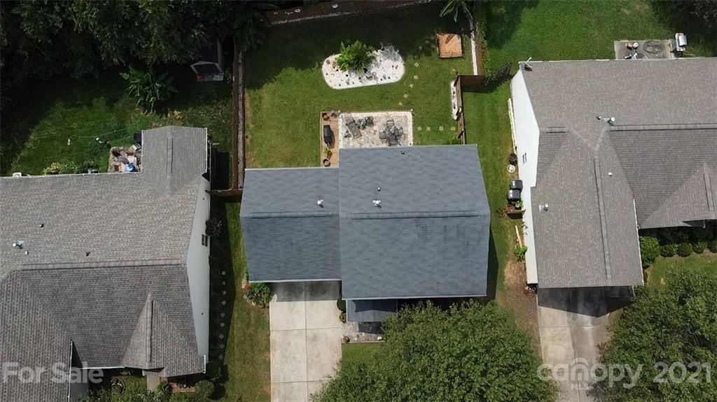 11427 Gold Pan Road Charlotte, NC 28215 - Photo 2 of 34 an aerial view of a house with a garden and trees