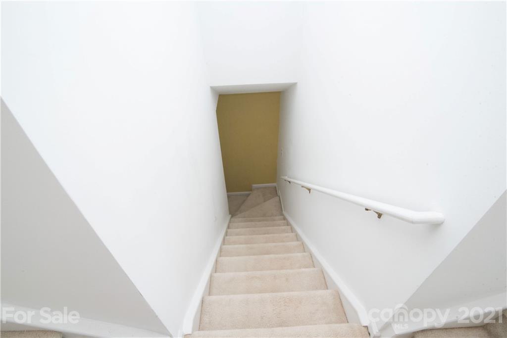 11427 Gold Pan Road Charlotte, NC 28215 - Photo 16 of 34 a view of a hallway with white walls