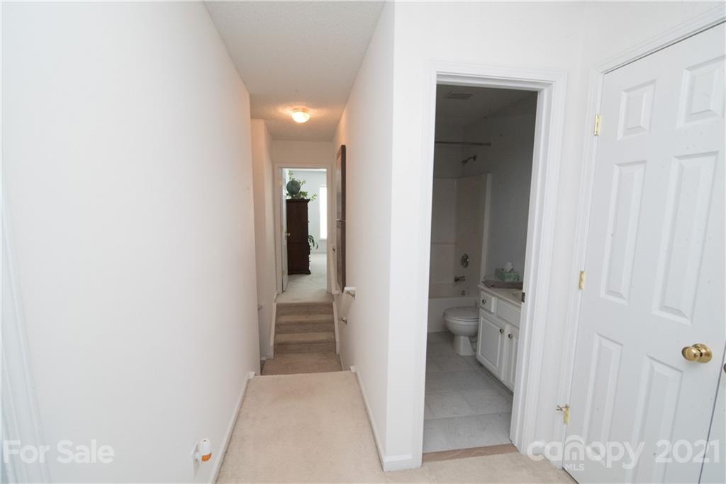 11427 Gold Pan Road Charlotte, NC 28215 - Photo 23 of 34 a bathroom with a sink and a mirror