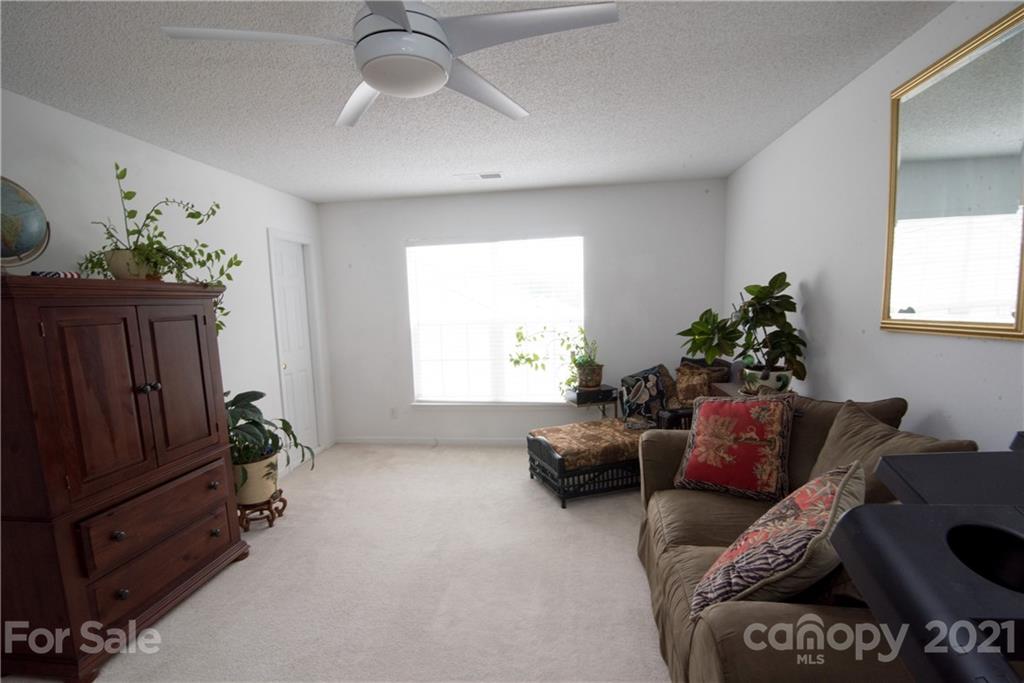 11427 Gold Pan Road Charlotte, NC 28215 - Photo 26 of 34 a living room with furniture and a window