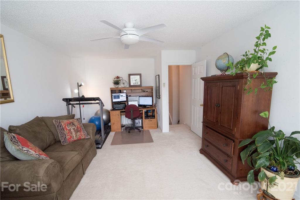 11427 Gold Pan Road Charlotte, NC 28215 - Photo 27 of 34 a living room with furniture flowerpot and wooden floor