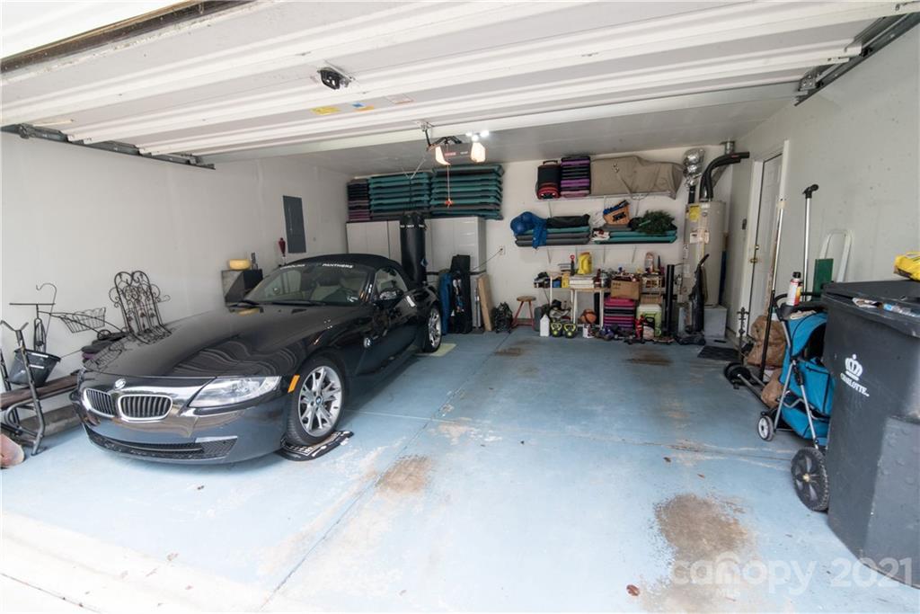 11427 Gold Pan Road Charlotte, NC 28215 - Photo 29 of 34 a car and bike in a garage