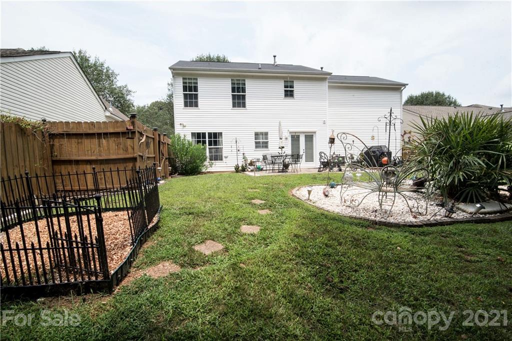 11427 Gold Pan Road Charlotte, NC 28215 - Photo 31 of 34 a view of a house with backyard and garden