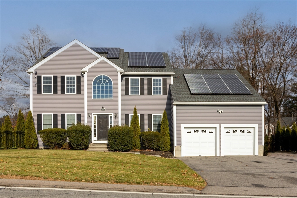 143 Potter Road Framingham, MA 01701 - Photo 1 of 42 a front view of a house with a yard