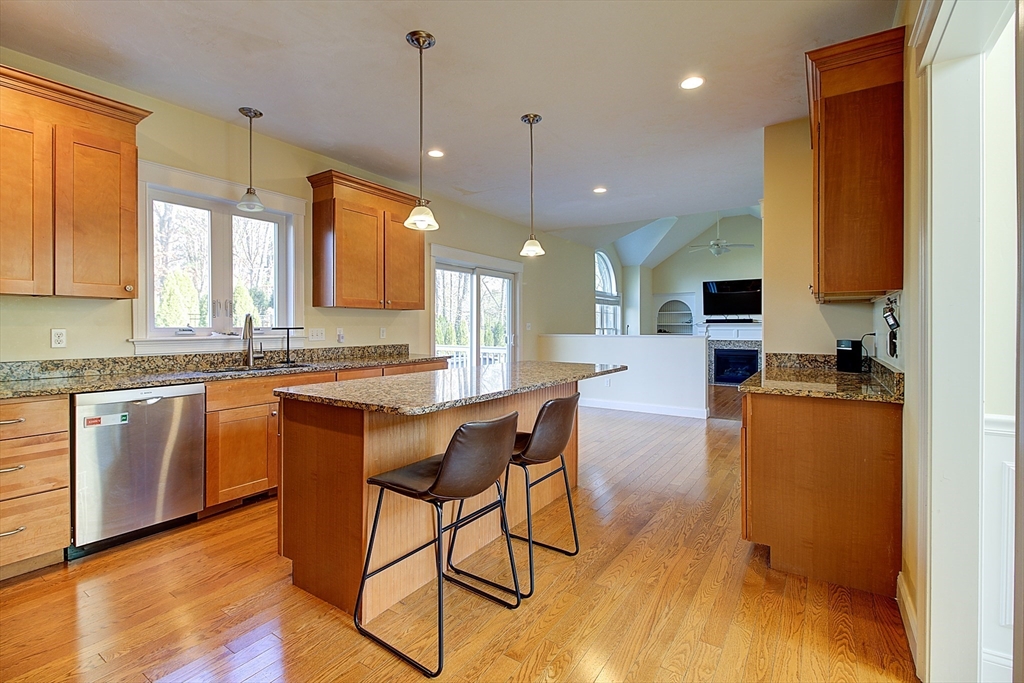 143 Potter Road Framingham, MA 01701 - Photo 13 of 42 a open kitchen with stainless steel appliances granite countertop a stove a sink a refrigerator and a microwave