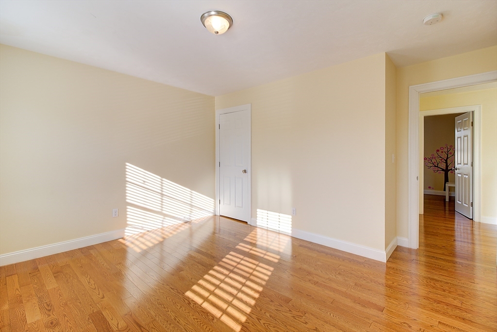 143 Potter Road Framingham, MA 01701 - Photo 19 of 42 a view of empty room with wooden floor