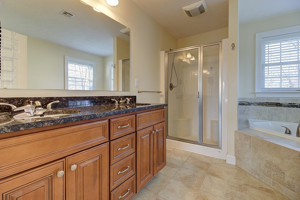 143 Potter Road Framingham, MA 01701 - Photo 26 of 42 a bathroom with a granite countertop sink and a bathtub