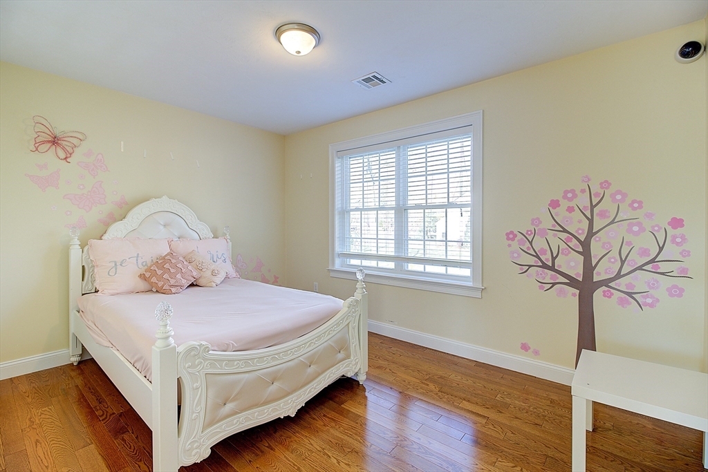 143 Potter Road Framingham, MA 01701 - Photo 29 of 42 a bedroom with a bed and a window