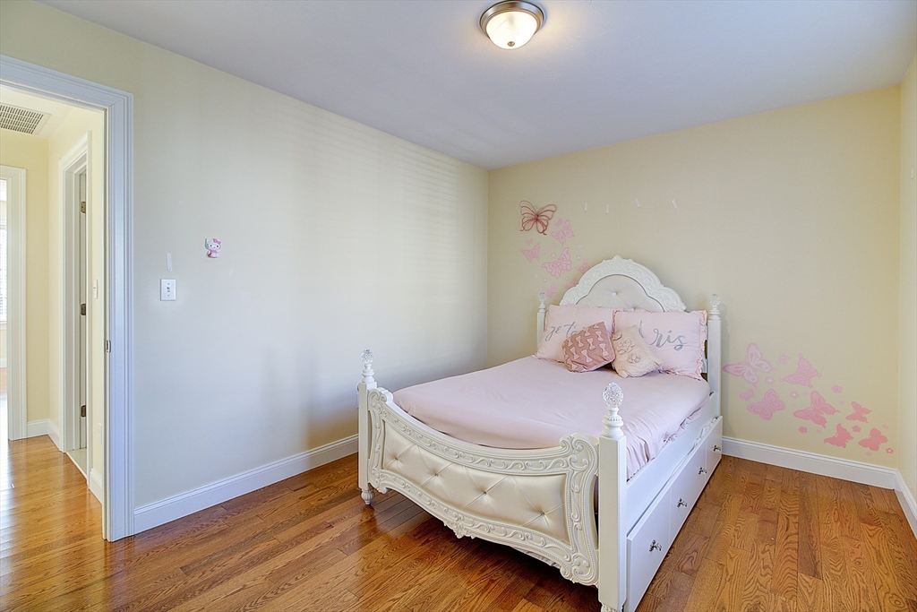 143 Potter Road Framingham, MA 01701 - Photo 30 of 42 a bed room with a bed and a small room