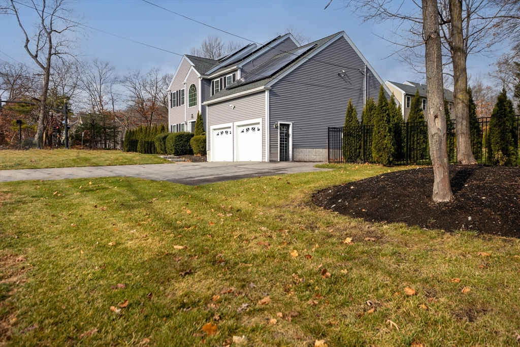 143 Potter Road Framingham, MA 01701 - Photo 3 of 42 a view of a house with a yard