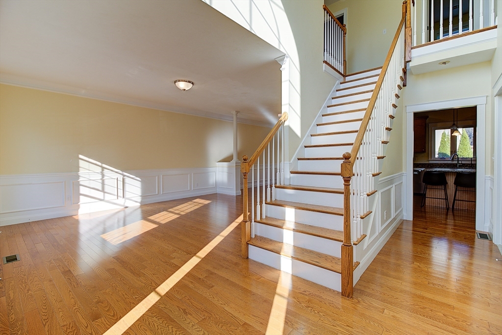 143 Potter Road Framingham, MA 01701 - Photo 4 of 42 a view of entryway and hall with wooden floor