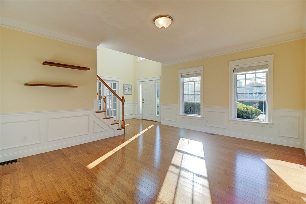 143 Potter Road Framingham, MA 01701 - Photo 5 of 42 a view of an empty room with wooden floor and a window