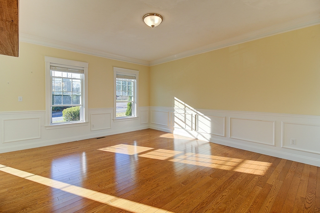 143 Potter Road Framingham, MA 01701 - Photo 6 of 42 a view of empty room with wooden floor and fan