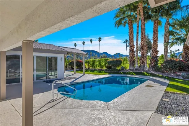 a view of a house with swimming pool
