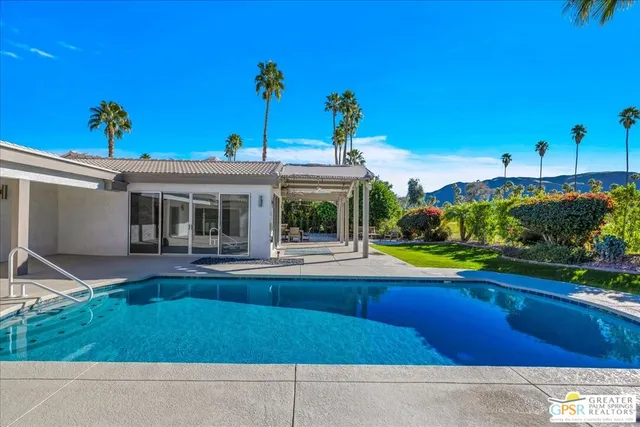 an aerial view of residential building and lake