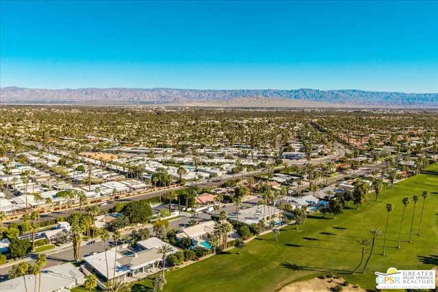 a view of a large body of water with a building in the background