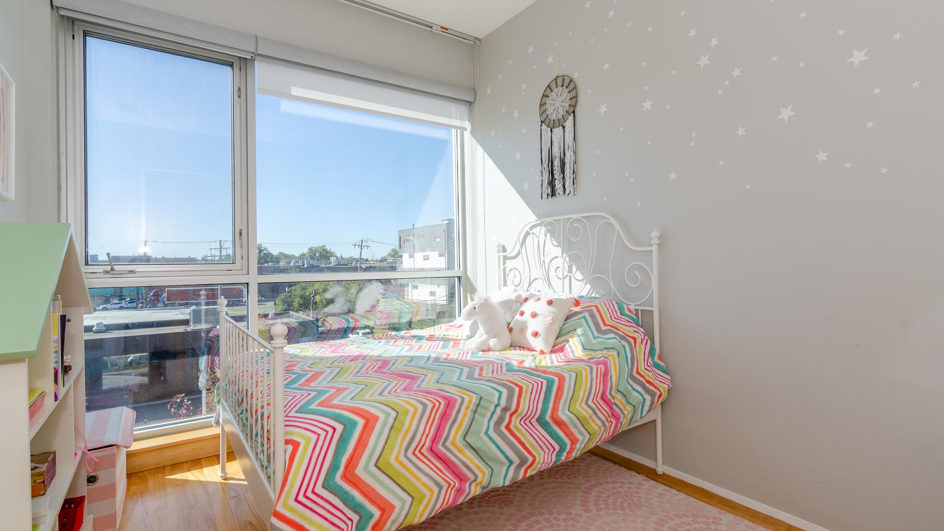 2408 West Rice Street, Unit 301 Chicago, IL 60622 - Photo 12 of 20 a bedroom with furniture and a large window