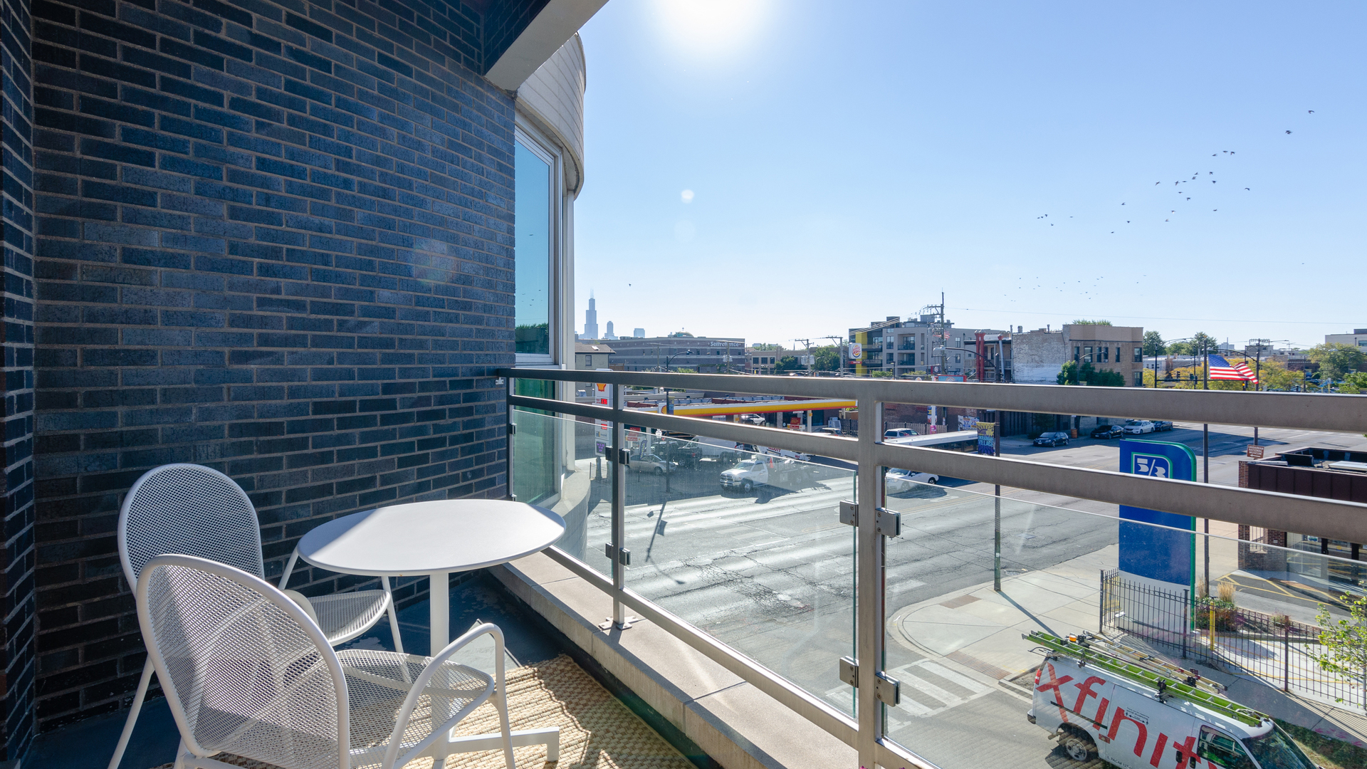 2408 West Rice Street, Unit 301 Chicago, IL 60622 - Photo 18 of 20 a balcony with table and chairs