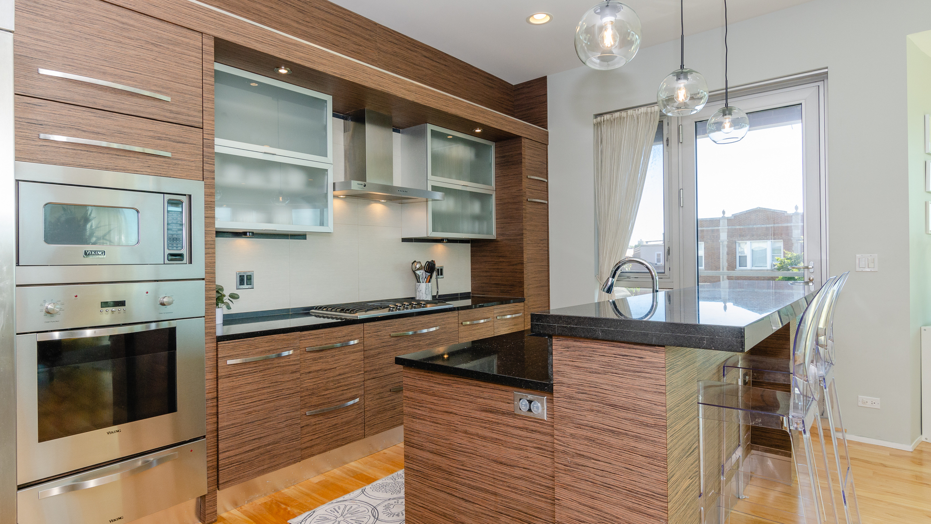 2408 West Rice Street, Unit 301 Chicago, IL 60622 - Photo 6 of 20 a kitchen with stainless steel appliances granite countertop a sink and a stove