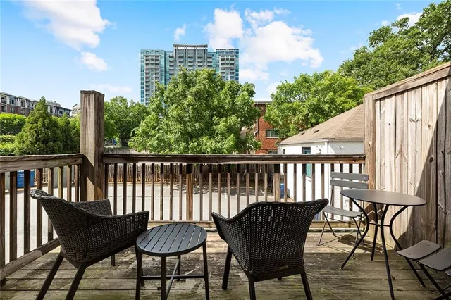 a view of a chair and table on the deck