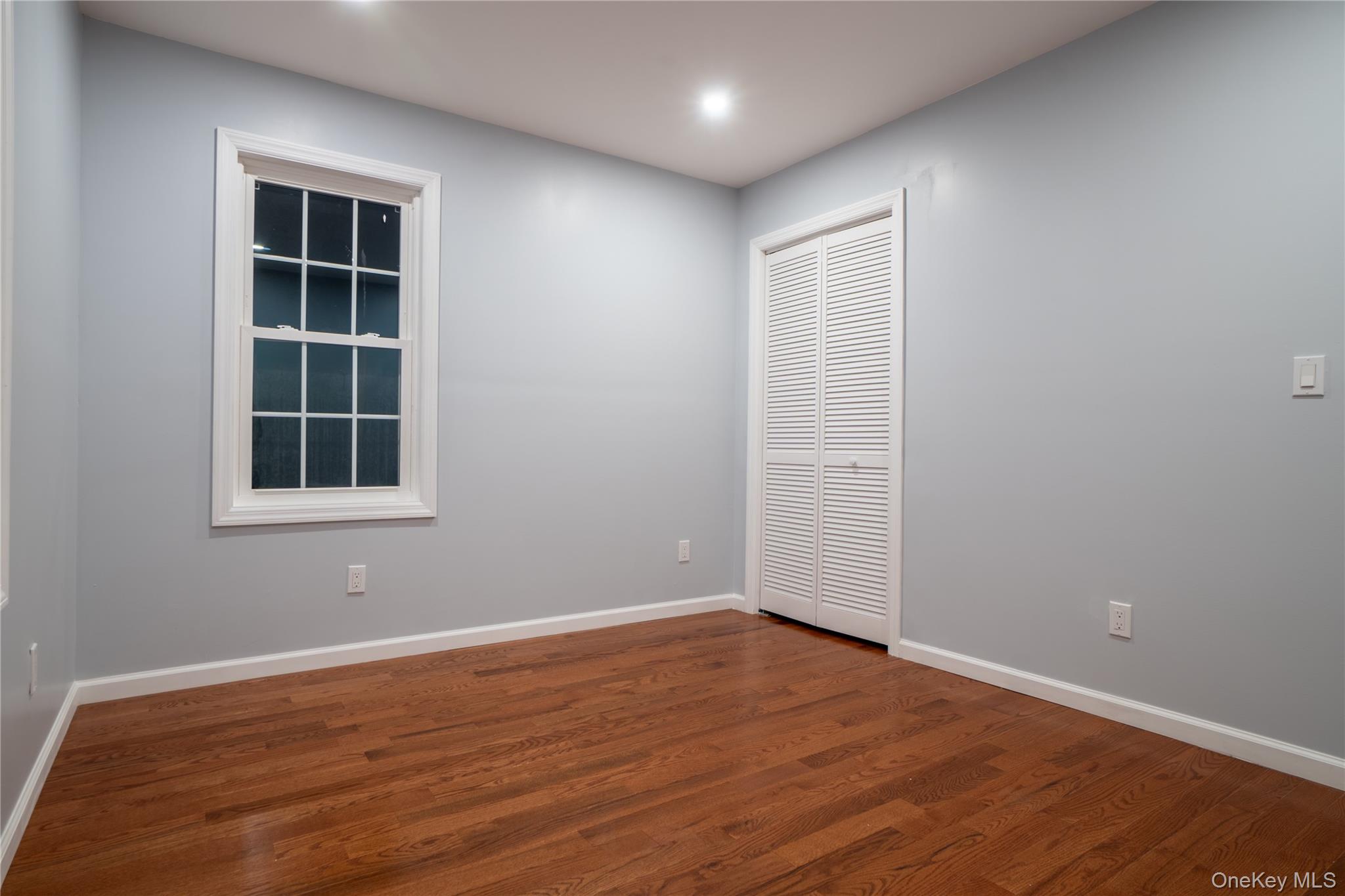 139 Maple Avenue Bethpage, NY 11714 - Photo 22 of 25 Spare room with wood finished floors and baseboards