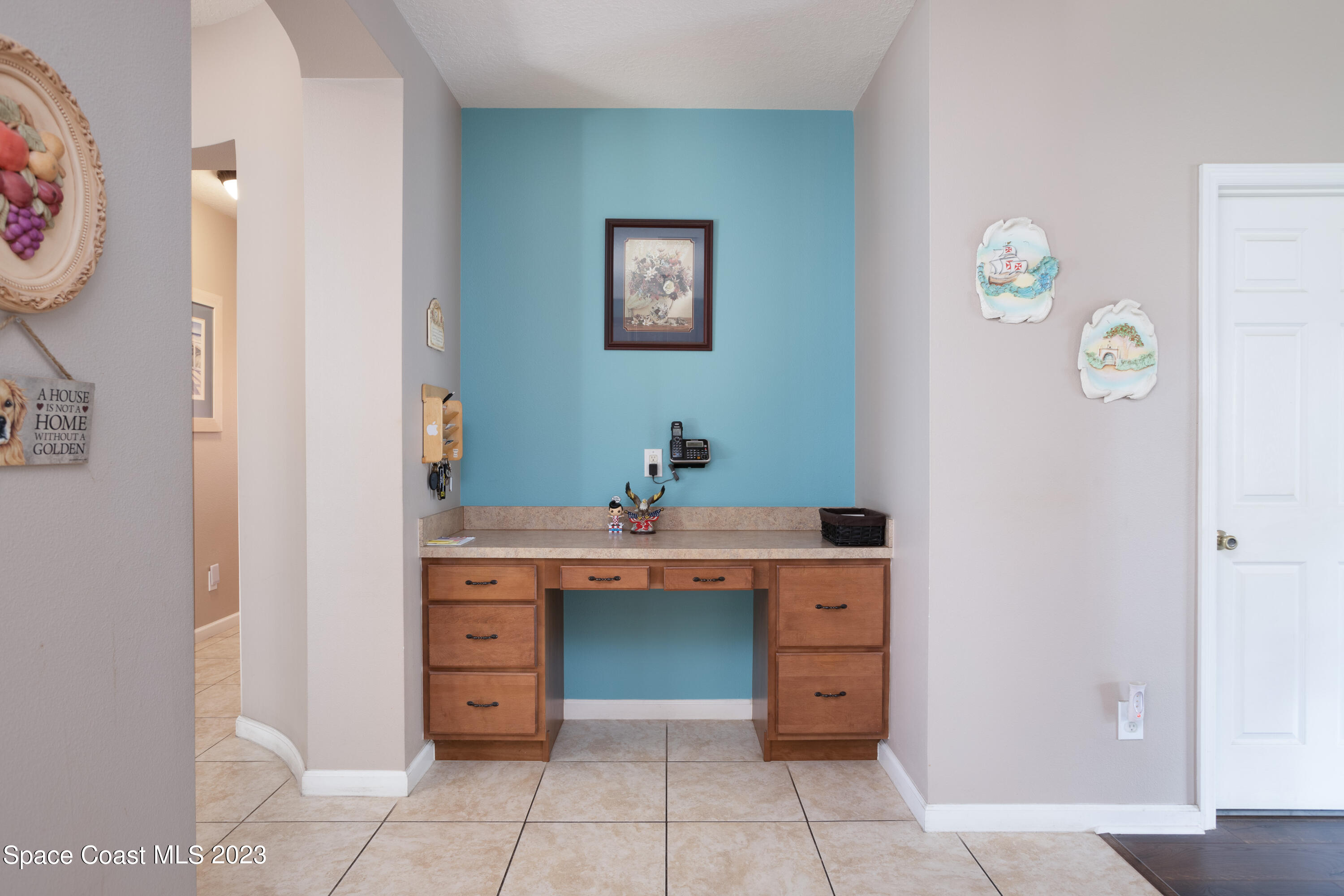 4130 Millicent Circle Melbourne, FL 32901 - Photo 11 of 28 a view of cabinets with wooden floor