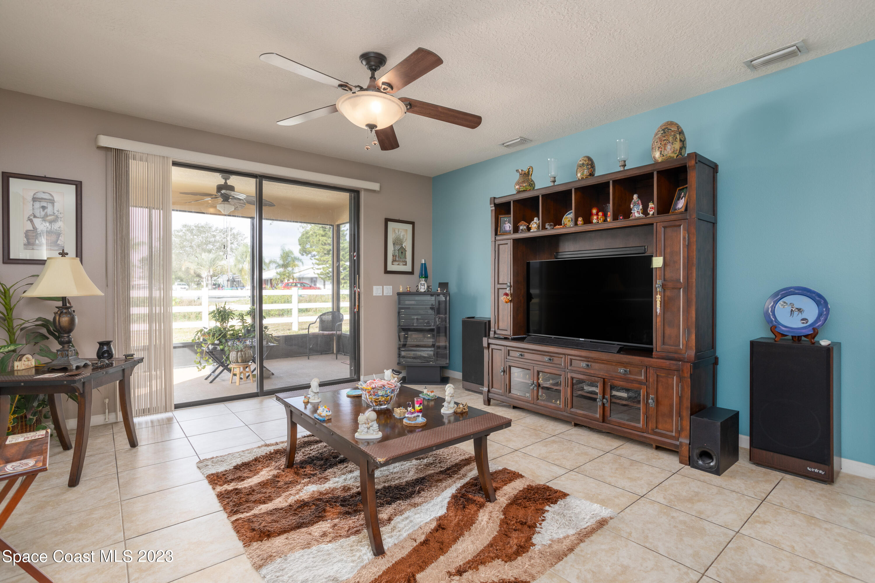 4130 Millicent Circle Melbourne, FL 32901 - Photo 14 of 28 a living room with furniture and a flat screen tv