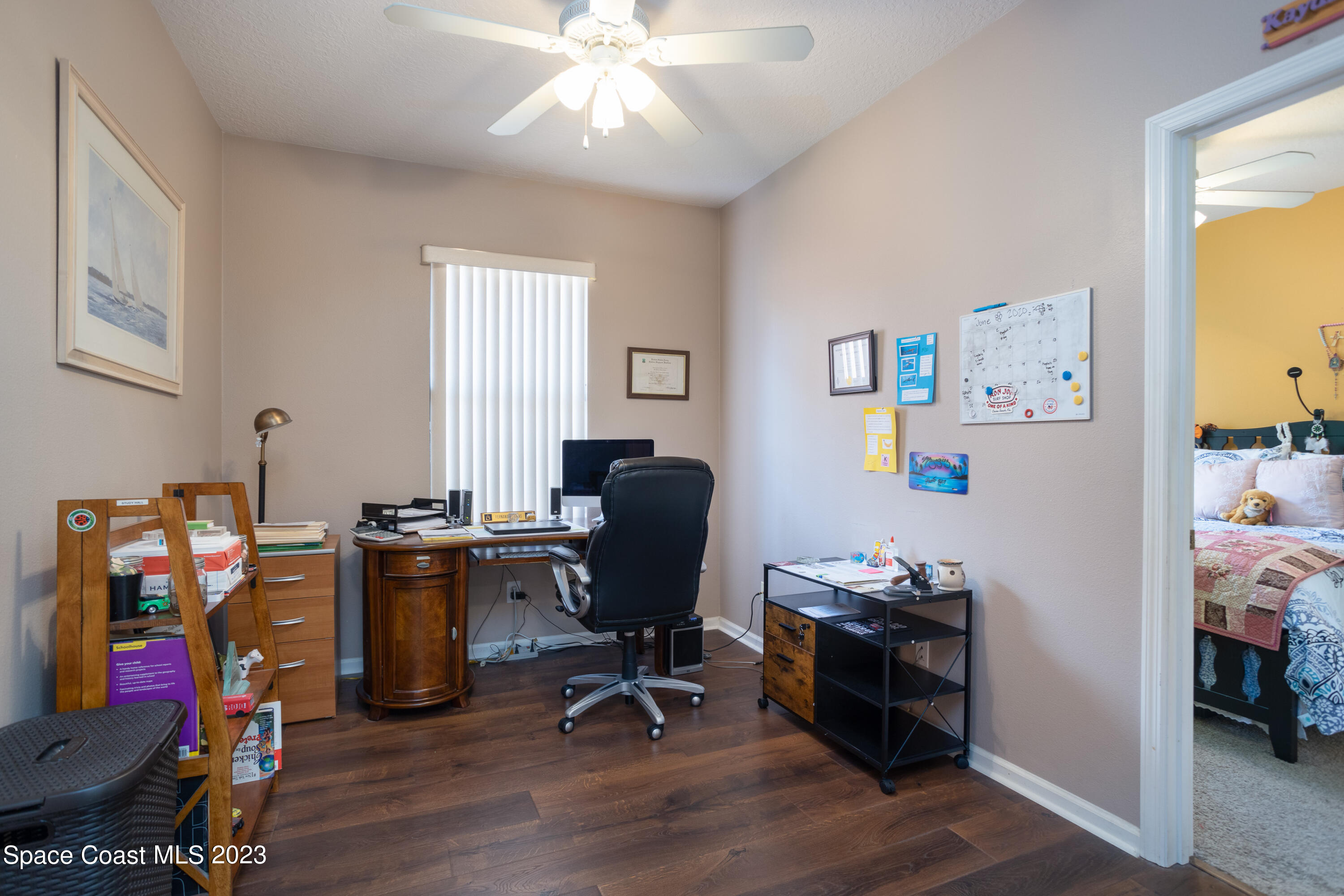 4130 Millicent Circle Melbourne, FL 32901 - Photo 20 of 28 a view of a workspace with furniture and a window