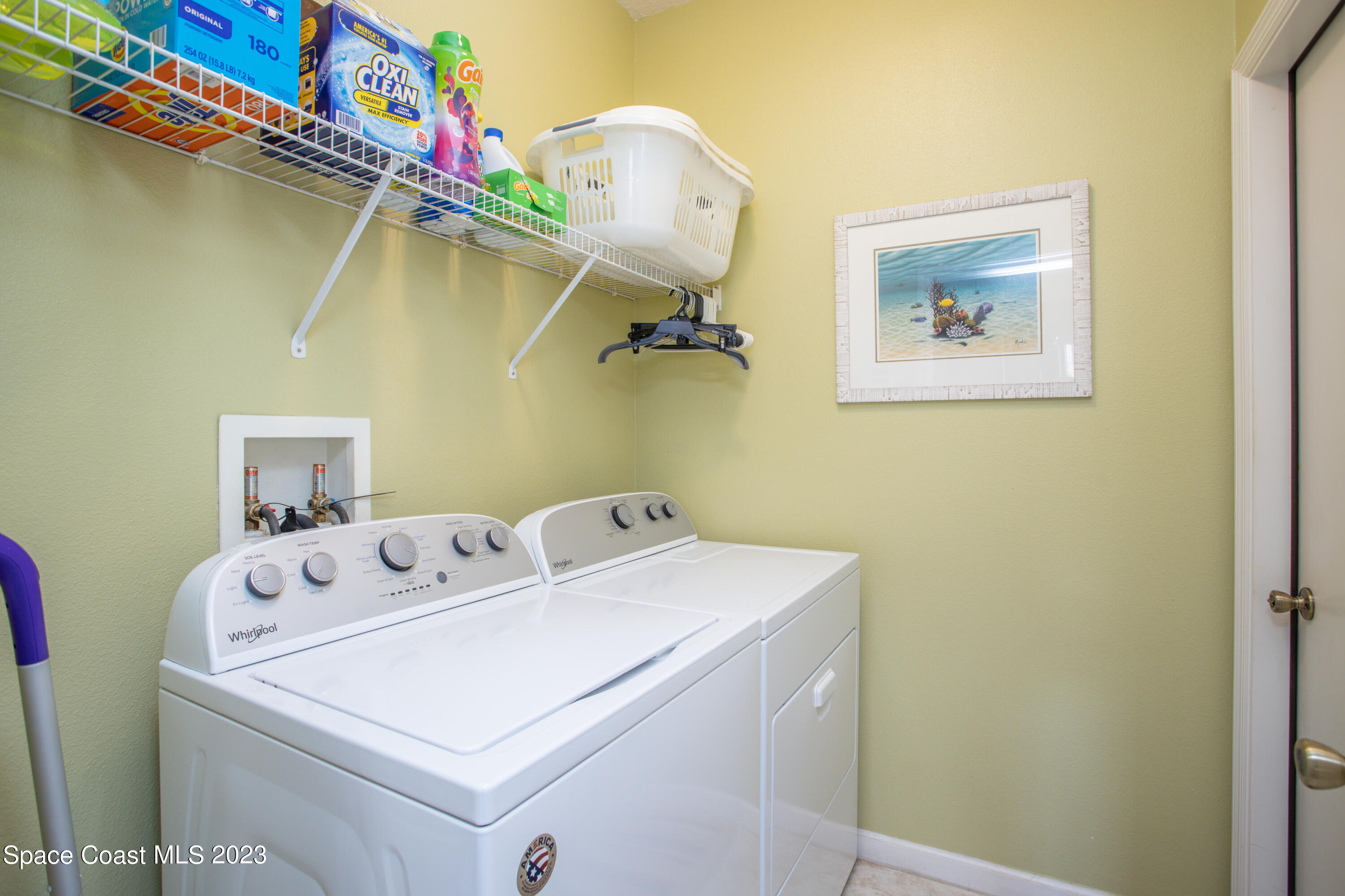 4130 Millicent Circle Melbourne, FL 32901 - Photo 24 of 28 a utility room with dryer and washer