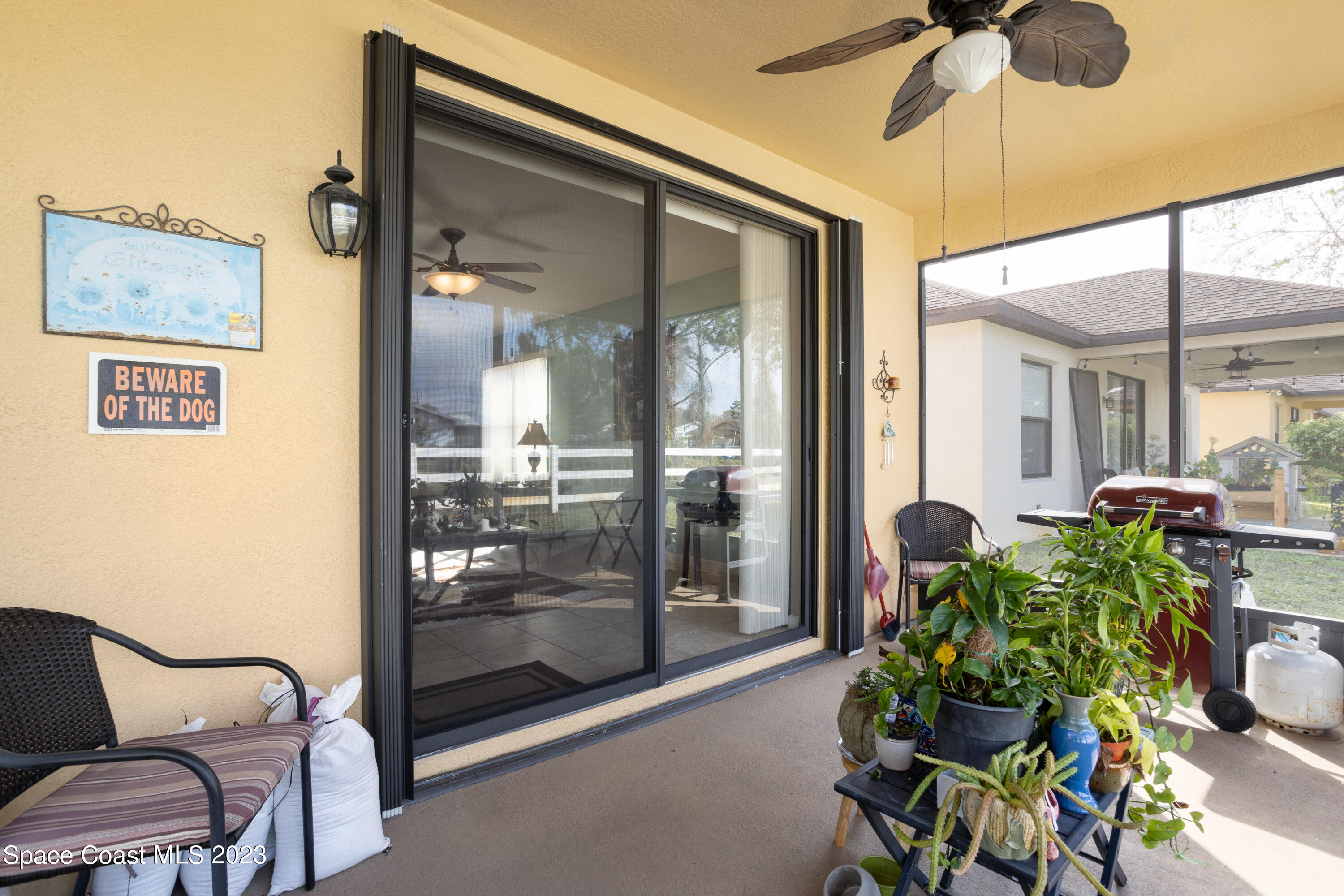 4130 Millicent Circle Melbourne, FL 32901 - Photo 25 of 28 a dining room with furniture and a potted plant
